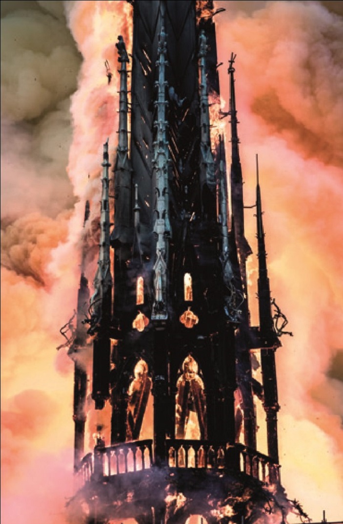 Notre Dame's spire engulfed by fire