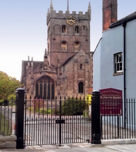 The church exterior with repaired gates, railings and piers with a black mid-sheen finish