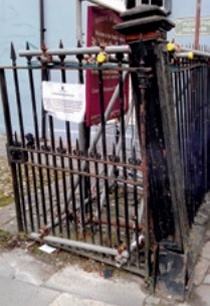 Damaged gate and pier before repair