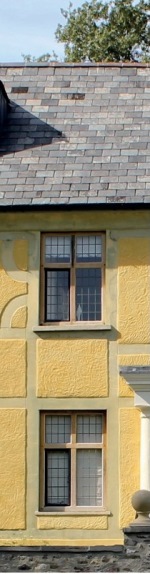 Restored facade with matching windows and new yellow ochre finish