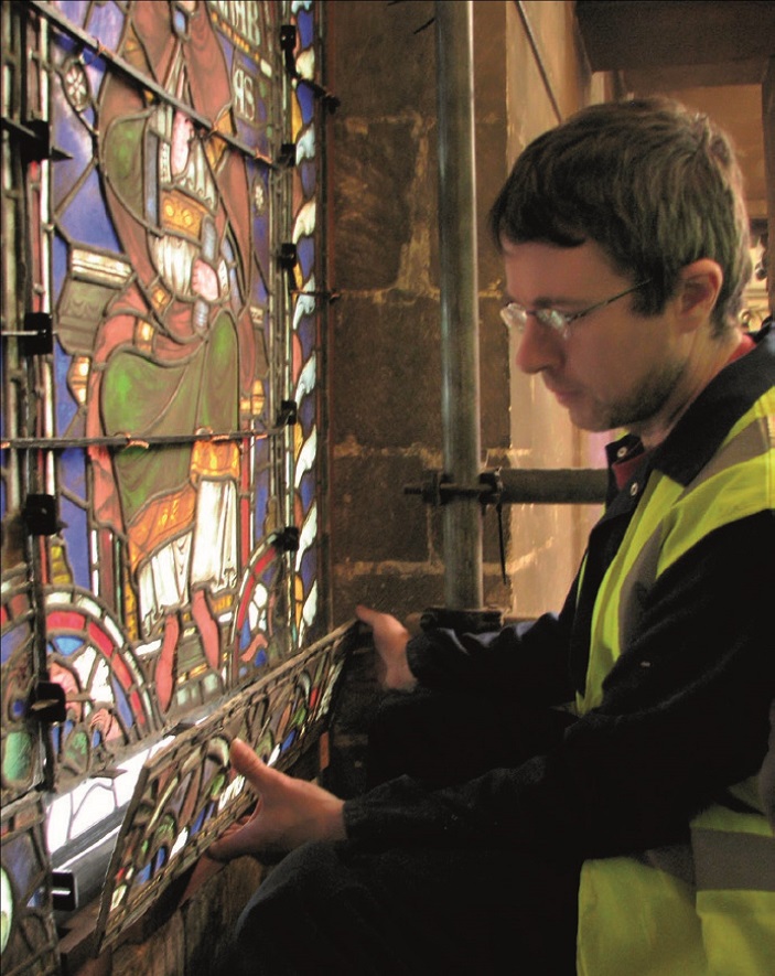Modified stained glass being installed