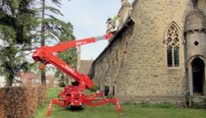 High level maintenance is carried out to church masonry with the aid of a cherry picker