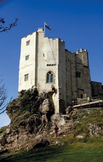 View of the castle in 2011 during the application of a hydraulic lime shelter coat using rope access