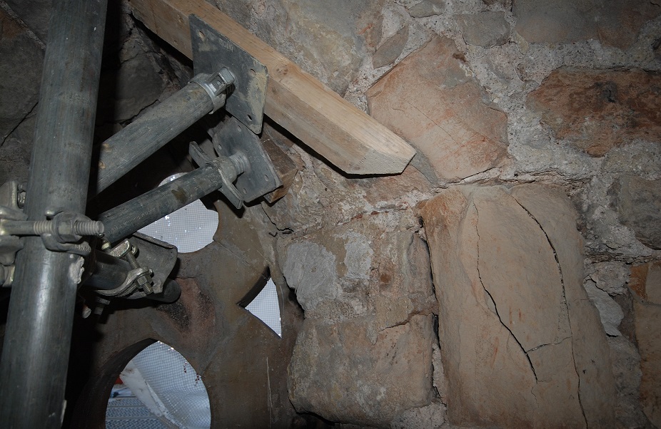 Cracked masonry caused by fire hose water damage