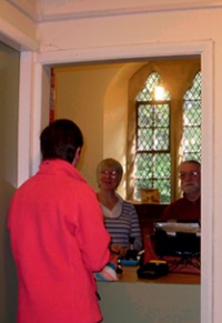 A customer uses the St Oswald’s Church post office