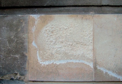 Limestone block marked by salt efflorescence