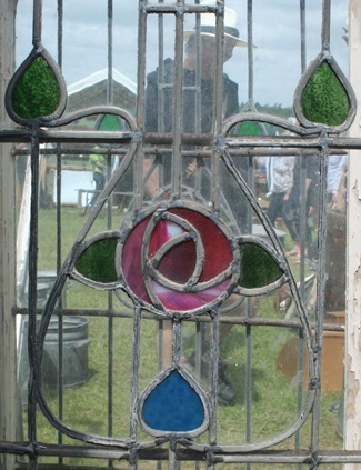 Leaded window with floral design in coloured glass