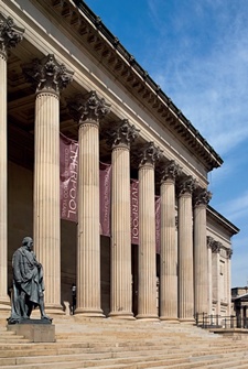 Sandstone Corinthian colonnade and statue of Disraeli, St George's Hall, Liverpool
