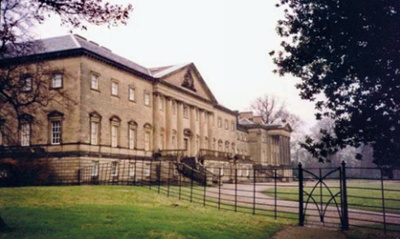 View of the neoclassical facade of Nostell Priory and surrounding parkland