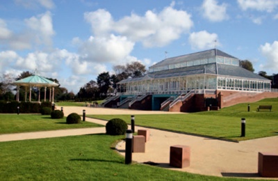 The restored Gladstone conservatory, the bandstand and landscaped paths and lawns