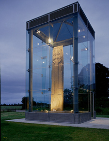 Stone cross in purpose-built glazed shelter with internal spot-lighting