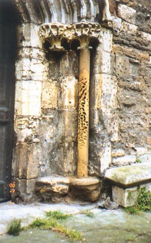 Stone pilaster deeply pitted by severe stone decay