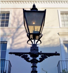 Gas lamp with ornate crossbar