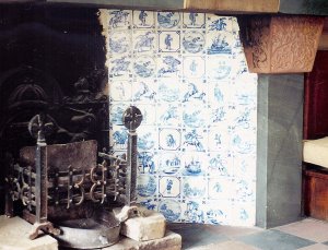 Area of vertical tile work featuring various designs including horse-riders and bucolic scenes