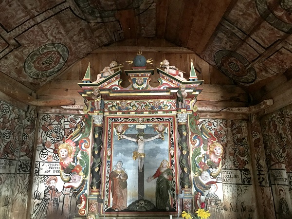 Wall paintings of either side of the alter in the chancel after cleaning and consolidation