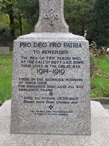 Lead lettering to the granite base of a stone cross (inscription begins: 'PRO DEO PRO PATRIA')