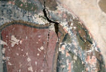 Close up of roundel showing large crack and widespread paint loss
