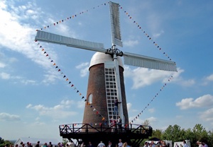 Wilton Windmill with bunting strung between the sails