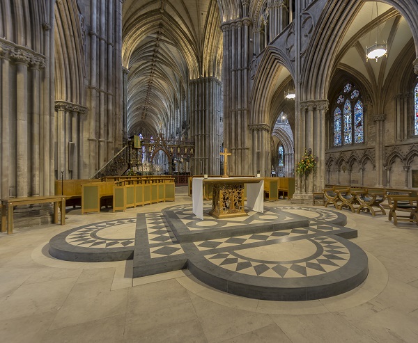 The nave alter at Lichfield Cathedral, lit by pendants in the arcades and high level spotlighting from within the triforium